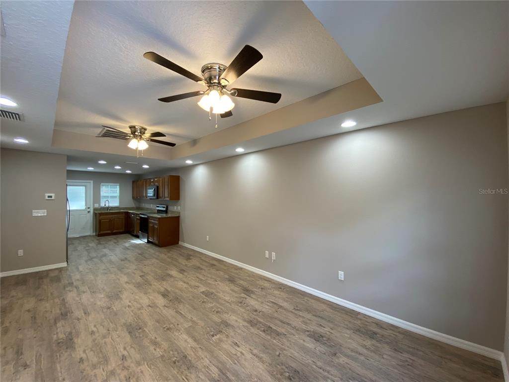8950 North Mendoza Way Citrus Springs, FL 34434 - Photo 6 of 35 an empty room with a ceiling fan and a window