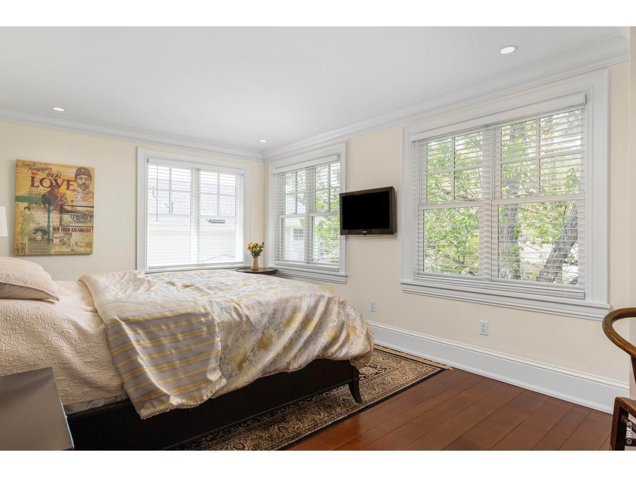3181 9th Street Boulder, CO 80304 - Photo 24 of 49 a bed sitting in a bedroom next to a window