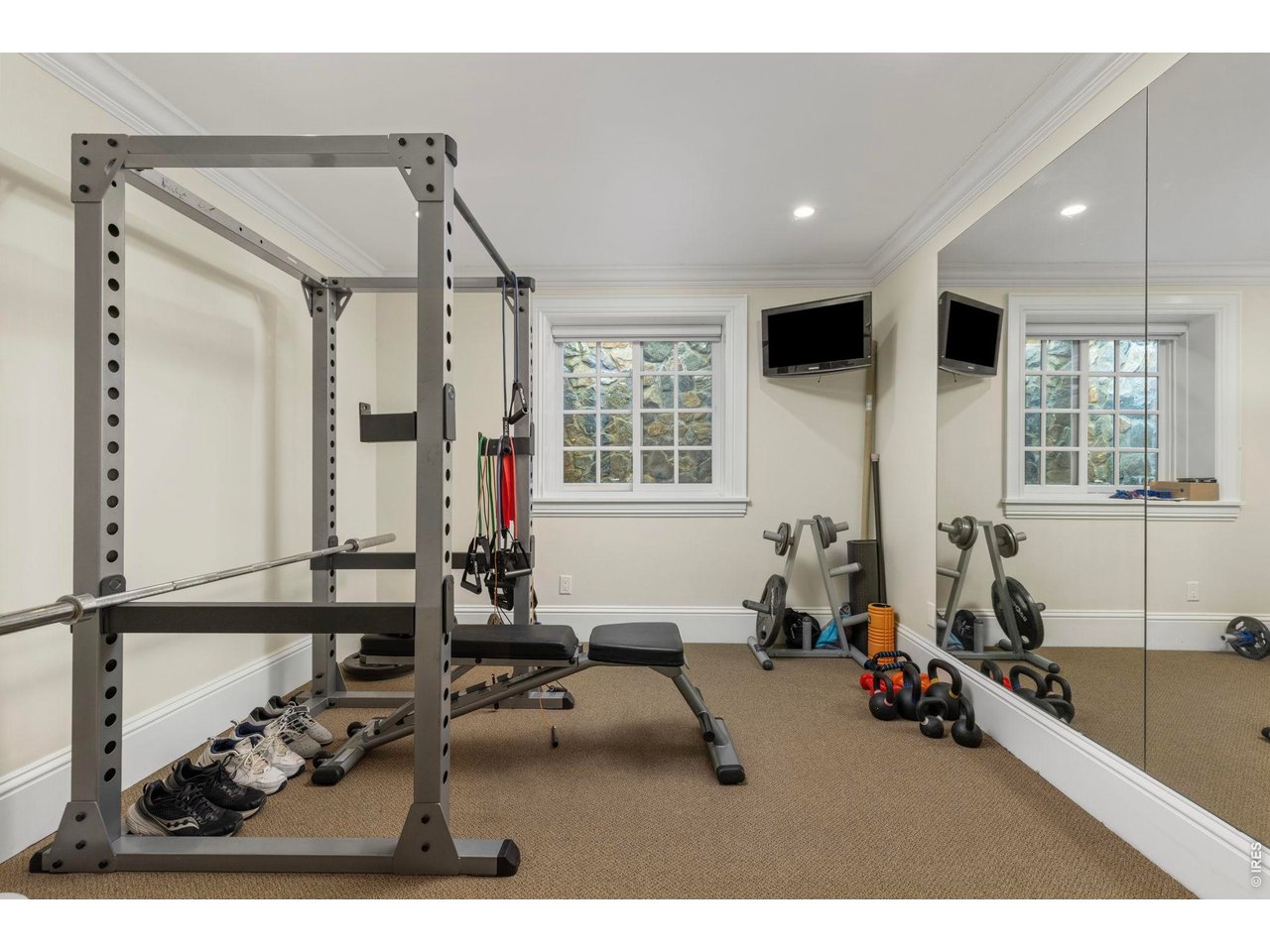 3181 9th Street Boulder, CO 80304 - Photo 36 of 49 a living room with furniture a window and gym equipment