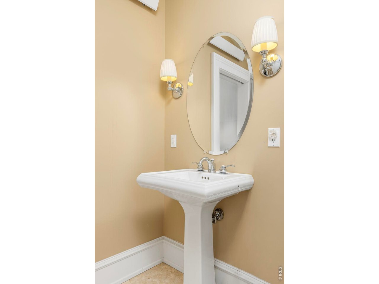 3181 9th Street Boulder, CO 80304 - Photo 41 of 49 a bathroom with a sink a mirror and vanity