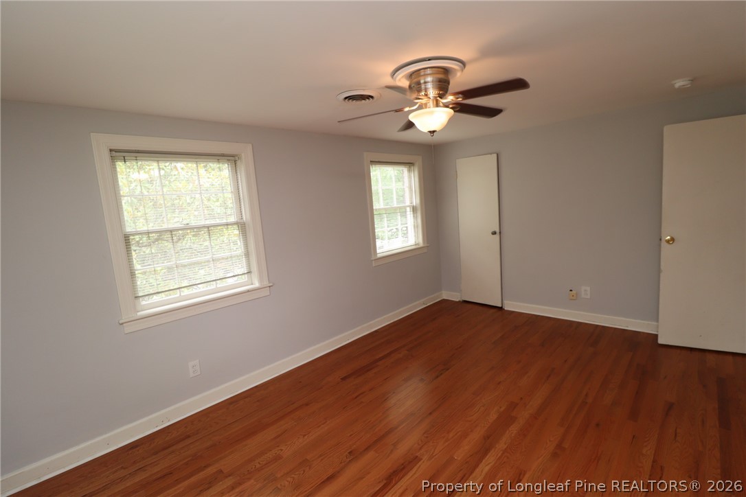 1000 Nichols Drive Raleigh, NC 27605 - Photo 15 of 22 a view of an empty room with wooden floor and a window