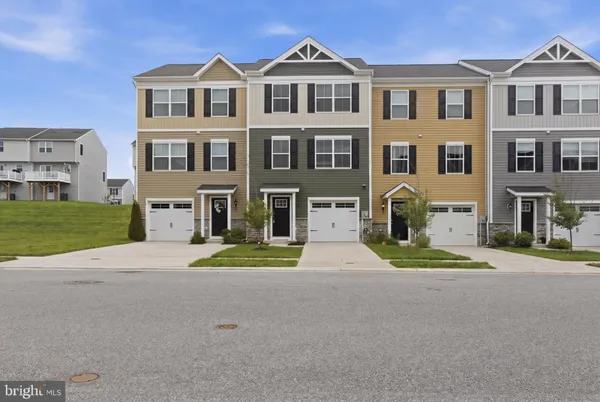 a view of multiple houses with a yard