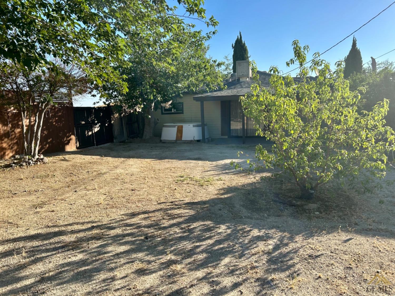 Undisclosed Address Maricopa, CA 93252 - Photo 12 of 32 a view of a yard with plants and trees
