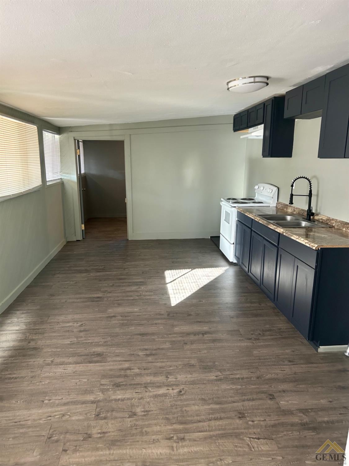Undisclosed Address Maricopa, CA 93252 - Photo 23 of 32 a view of a kitchen with a sink and cabinet