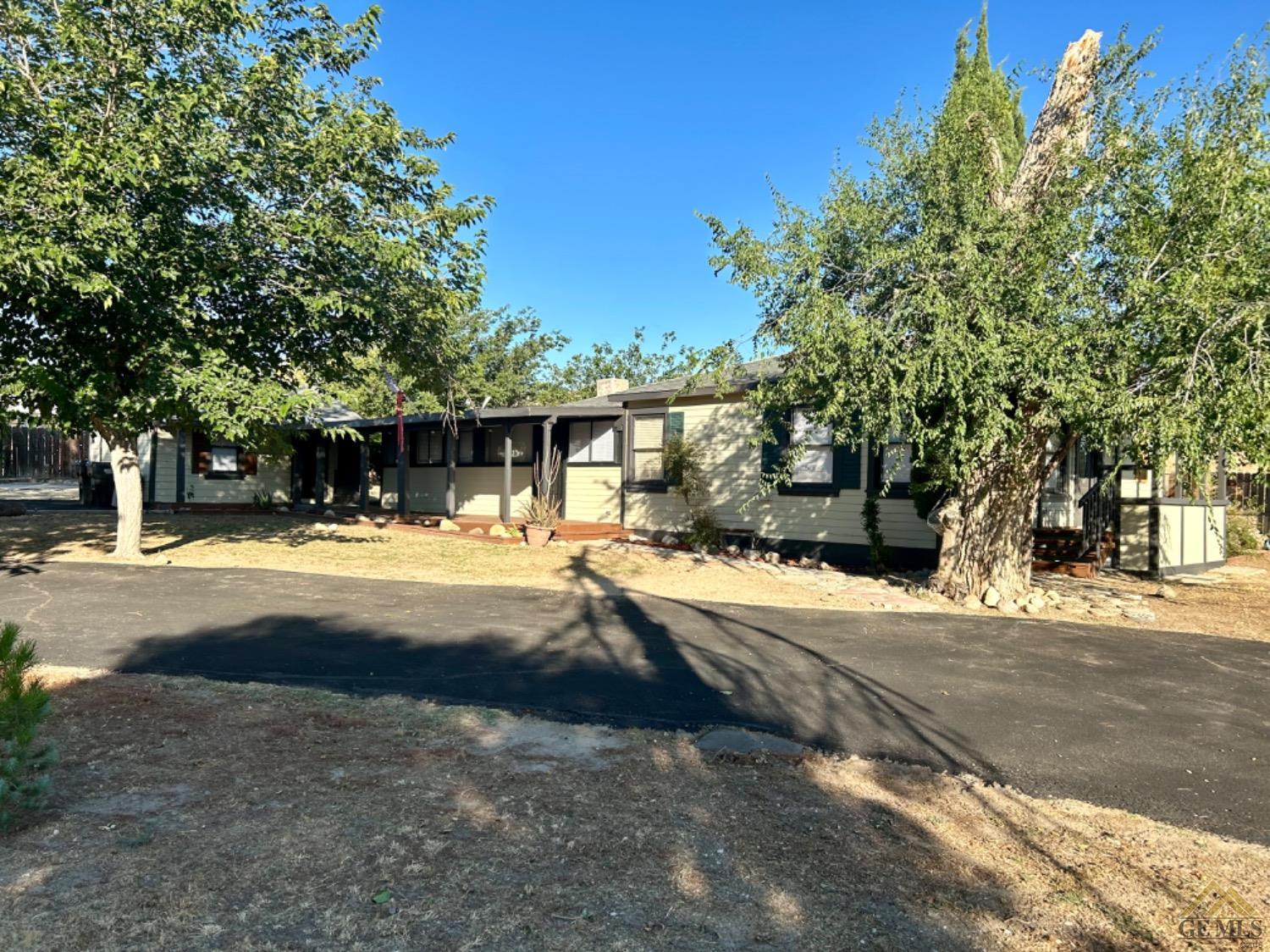 Undisclosed Address Maricopa, CA 93252 - Photo 32 of 32 a view of street with large trees