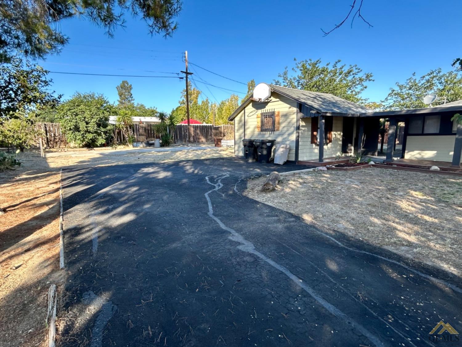 Undisclosed Address Maricopa, CA 93252 - Photo 7 of 32 a view of a house with a yard and sitting area