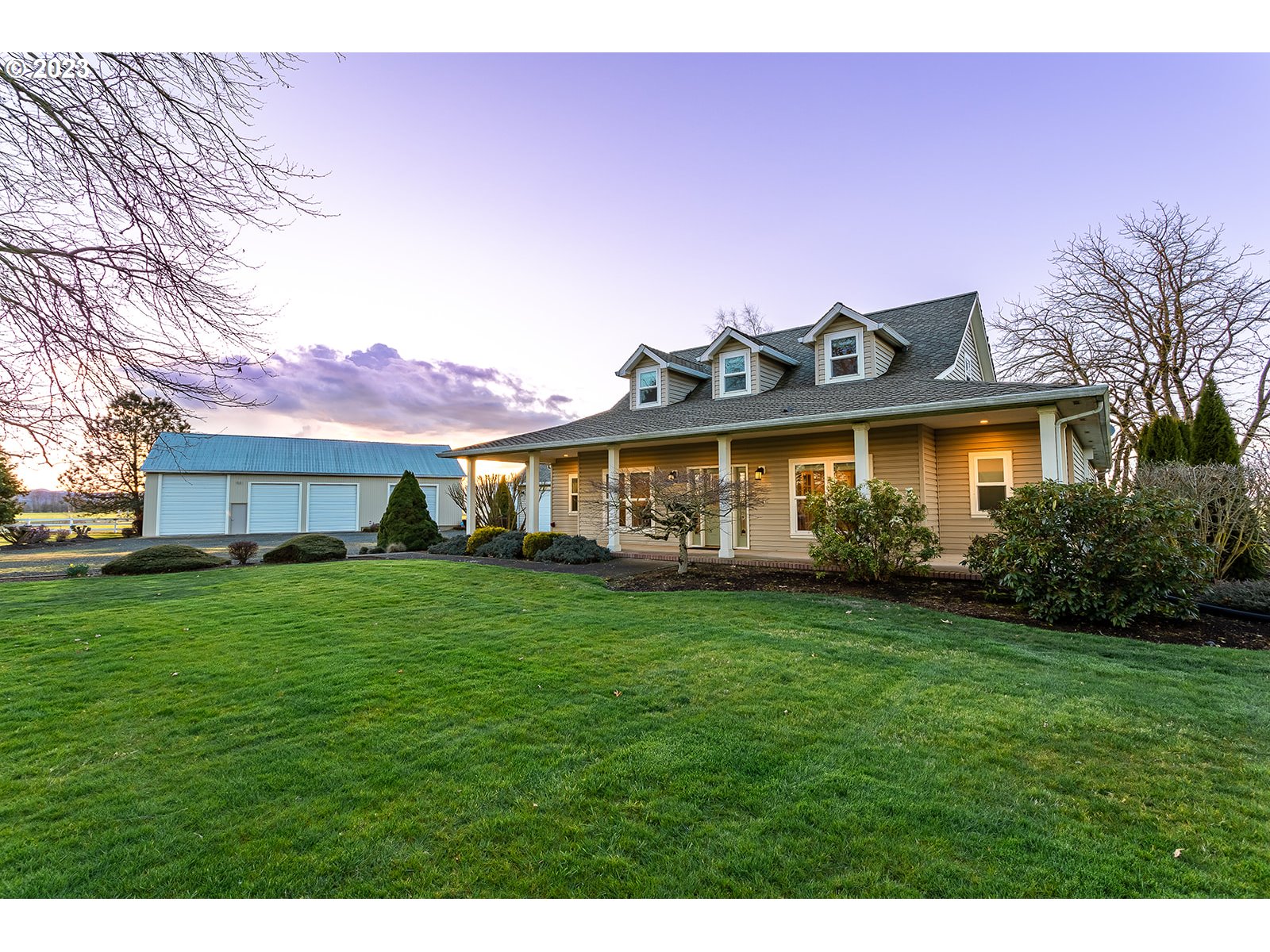 28179 High Pass Road Junction City, OR 97448 - Photo 1 of 48 a front view of a house with a garden