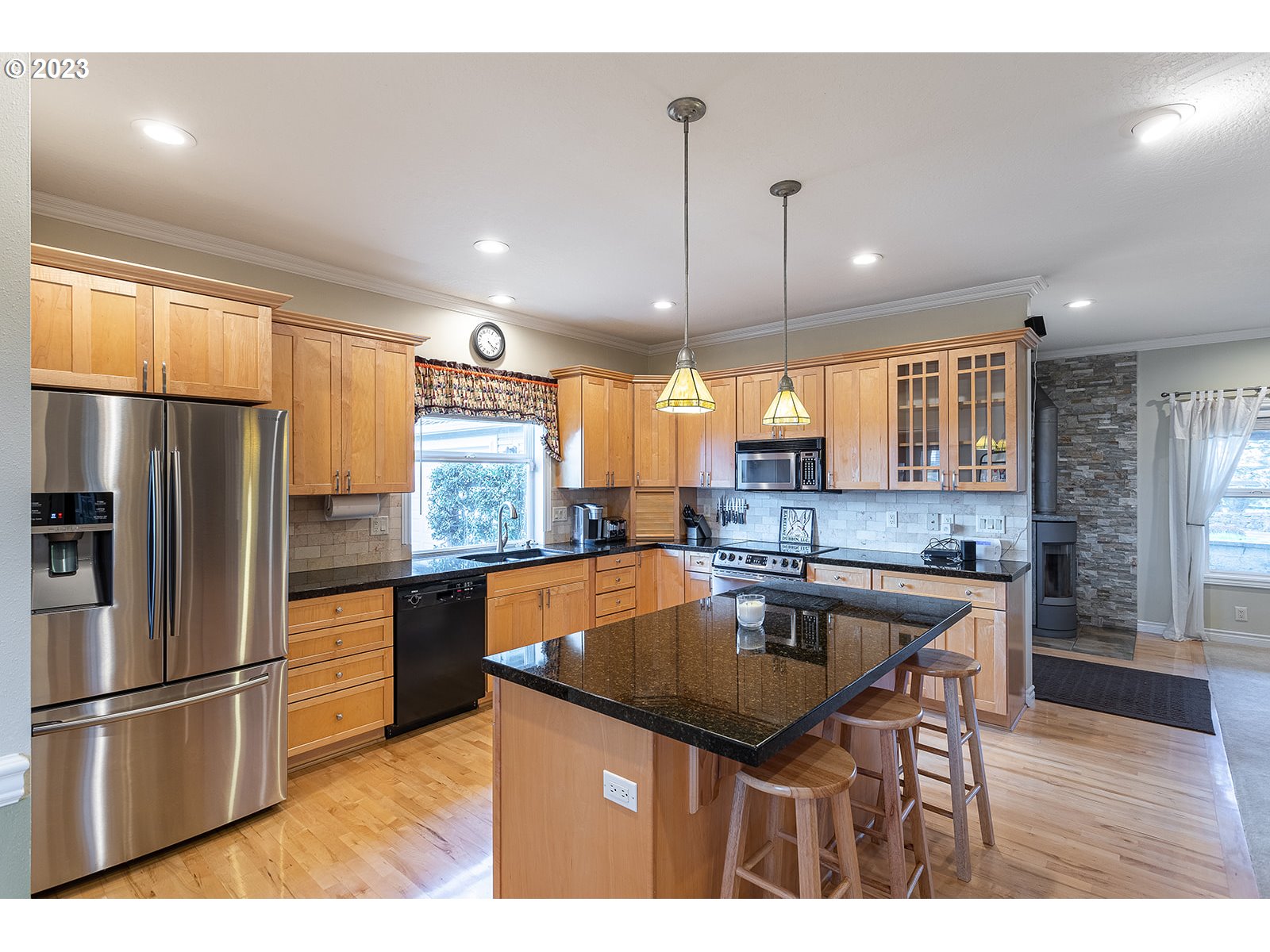 28179 High Pass Road Junction City, OR 97448 - Photo 12 of 48 a kitchen with stainless steel appliances granite countertop a kitchen island hardwood floor sink and stove