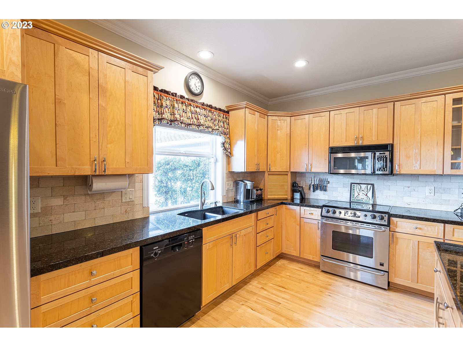 28179 High Pass Road Junction City, OR 97448 - Photo 14 of 48 a kitchen with stainless steel appliances granite countertop a stove a sink and a microwave