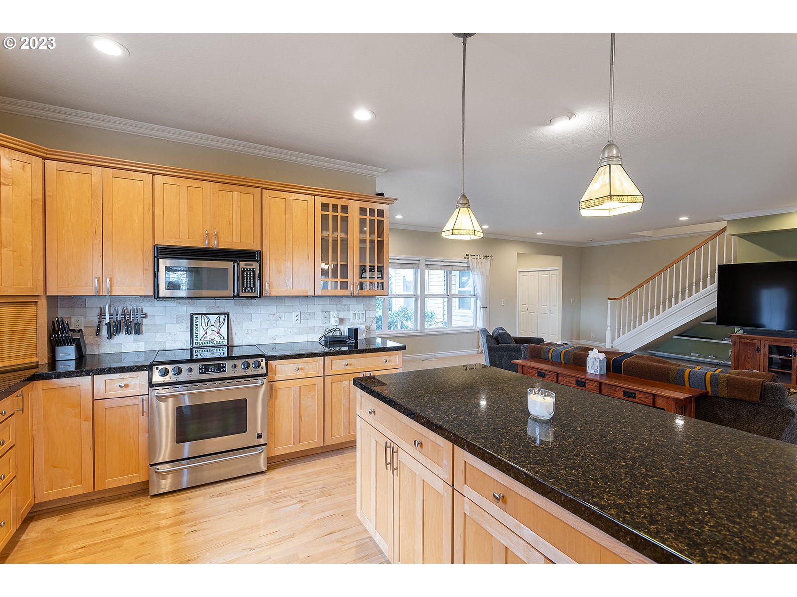 28179 High Pass Road Junction City, OR 97448 - Photo 16 of 48 a kitchen with stainless steel appliances granite countertop a sink a stove and a microwave