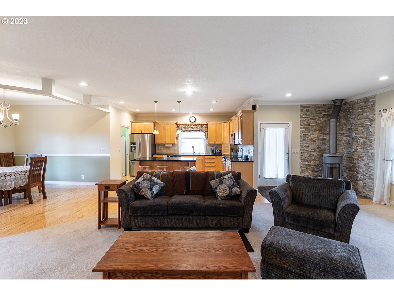 28179 High Pass Road Junction City, OR 97448 - Photo 19 of 48 a living room with furniture and a view of kitchen