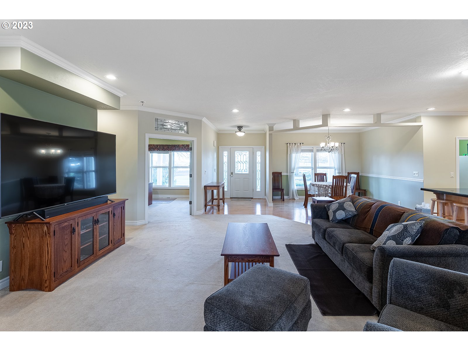 28179 High Pass Road Junction City, OR 97448 - Photo 20 of 48 a living room with furniture and a flat screen tv