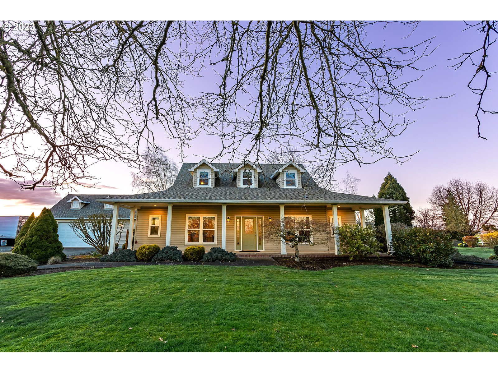 28179 High Pass Road Junction City, OR 97448 - Photo 2 of 48 a front view of a house with a garden