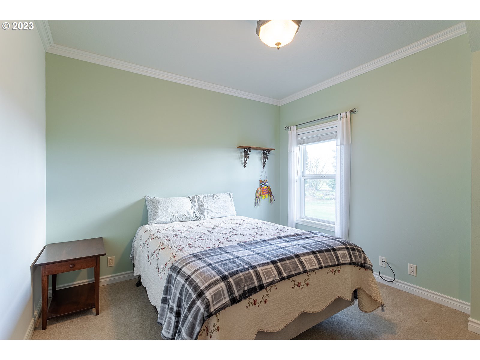 28179 High Pass Road Junction City, OR 97448 - Photo 26 of 48 a bedroom with a bed window and a table