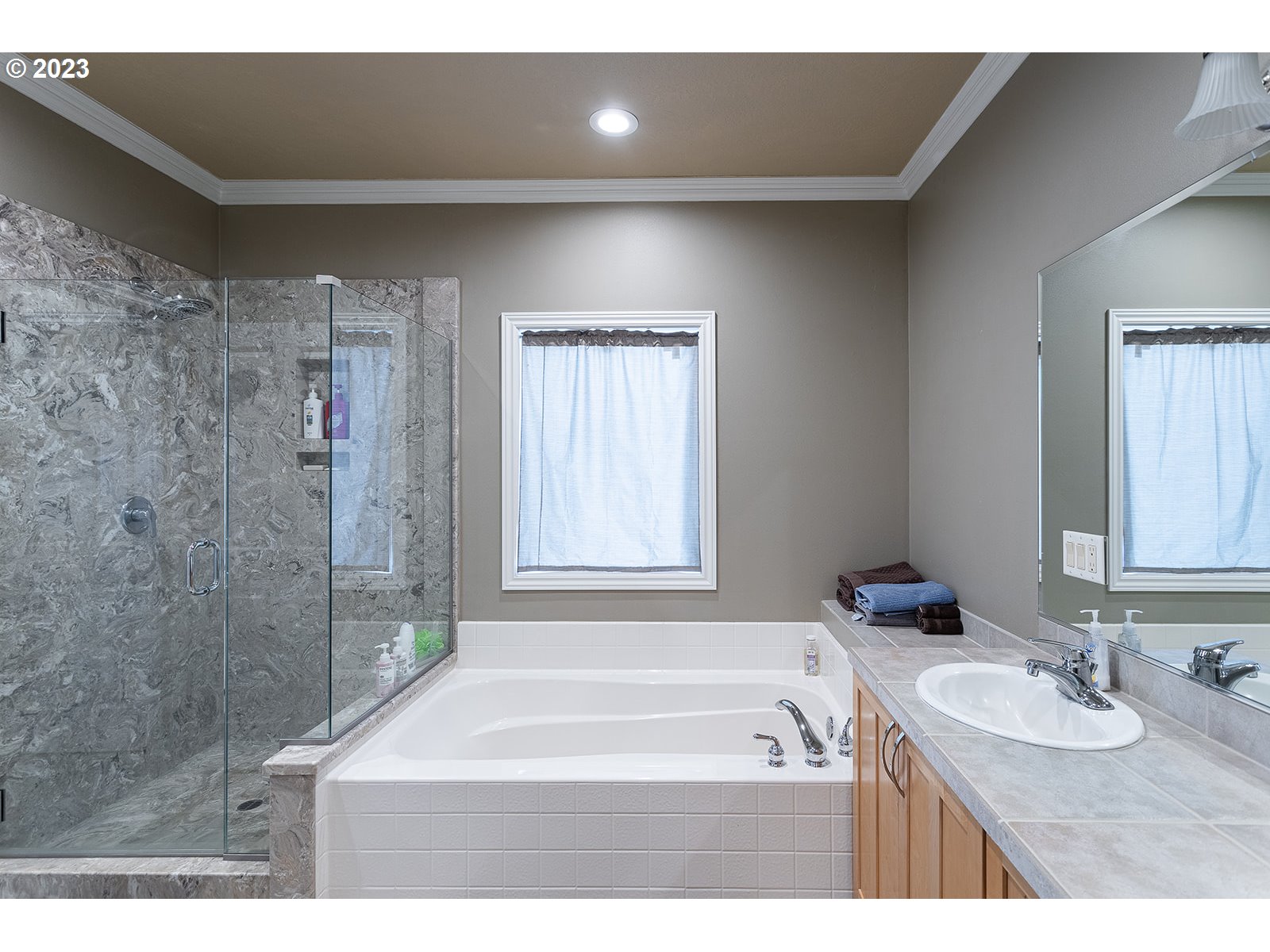 28179 High Pass Road Junction City, OR 97448 - Photo 30 of 48 a bathroom with a tub a sink and a shower