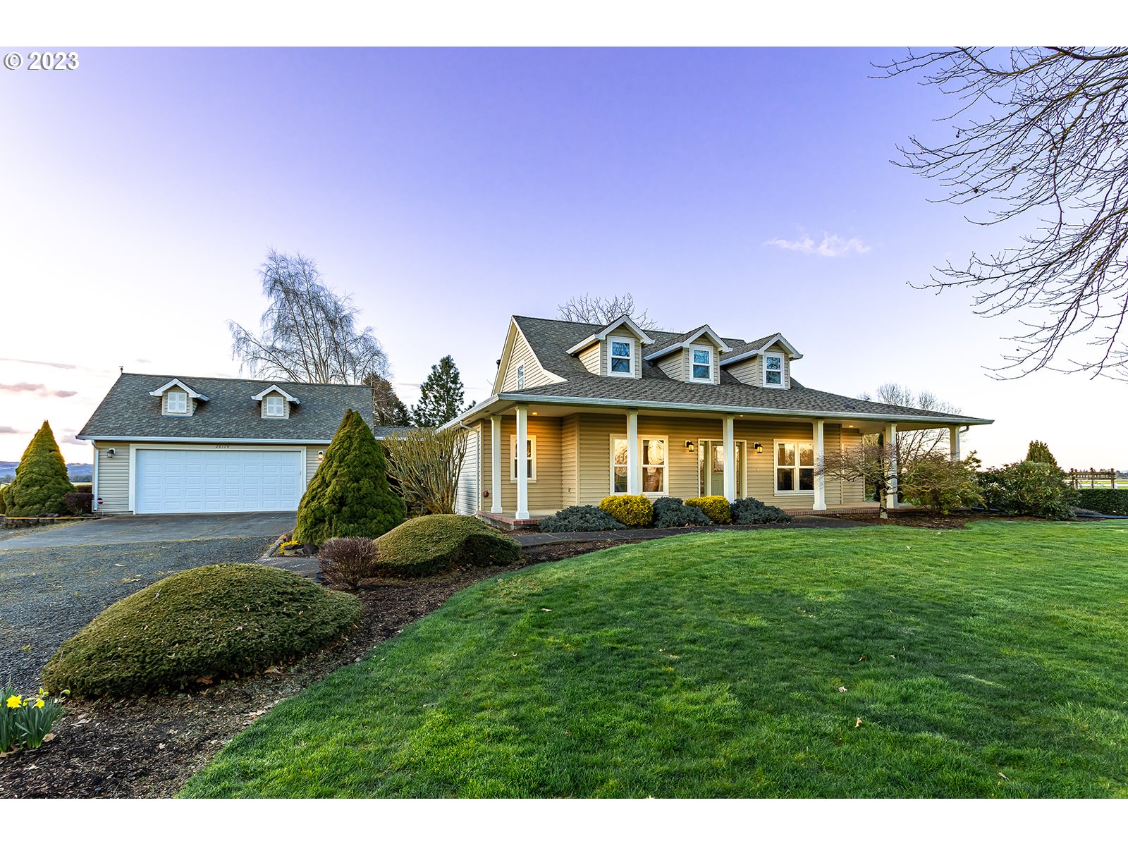 28179 High Pass Road Junction City, OR 97448 - Photo 3 of 48 a view of a big house with a big yard and potted plants