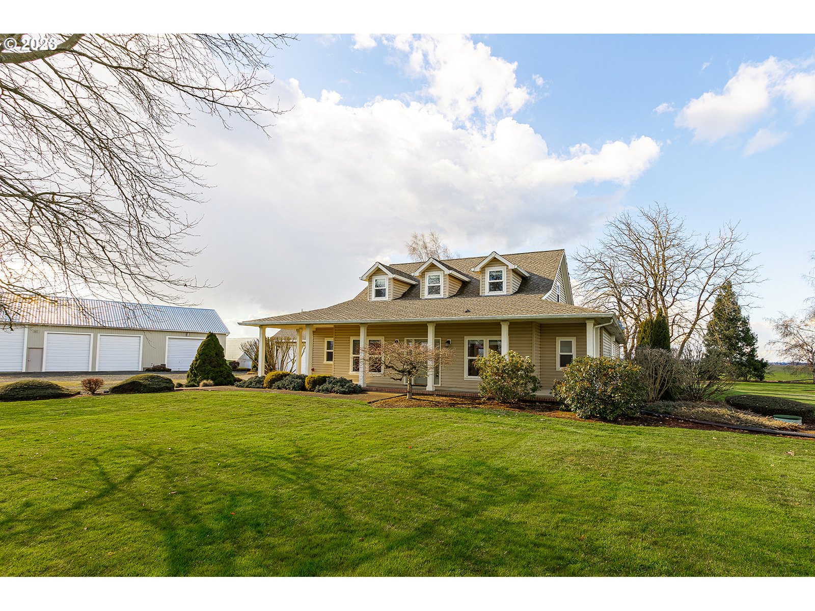 28179 High Pass Road Junction City, OR 97448 - Photo 45 of 48 a view of a house with a big yard and large trees