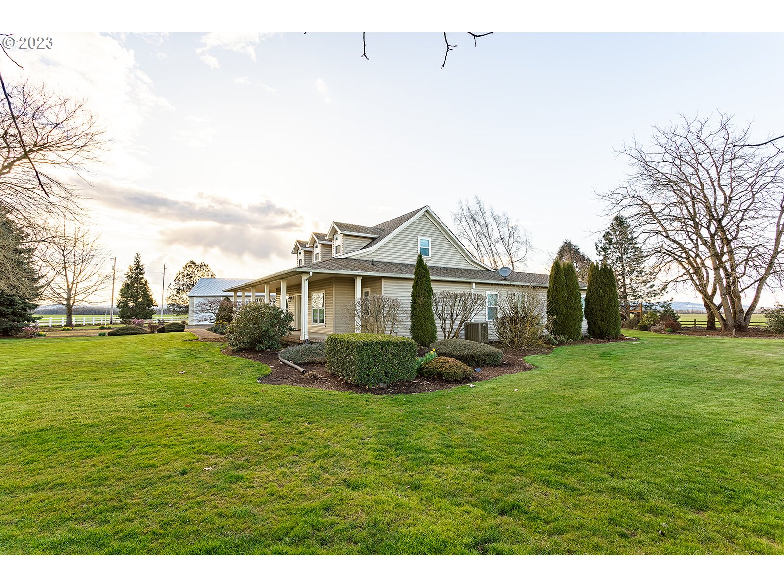 28179 High Pass Road Junction City, OR 97448 - Photo 8 of 48 a front view of a house with a garden