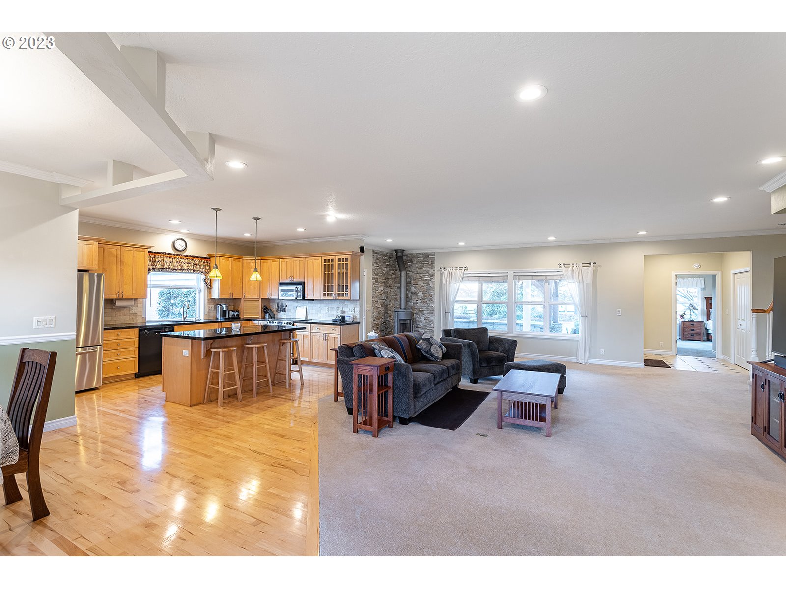 28179 High Pass Road Junction City, OR 97448 - Photo 10 of 48 a living room with furniture and kitchen view