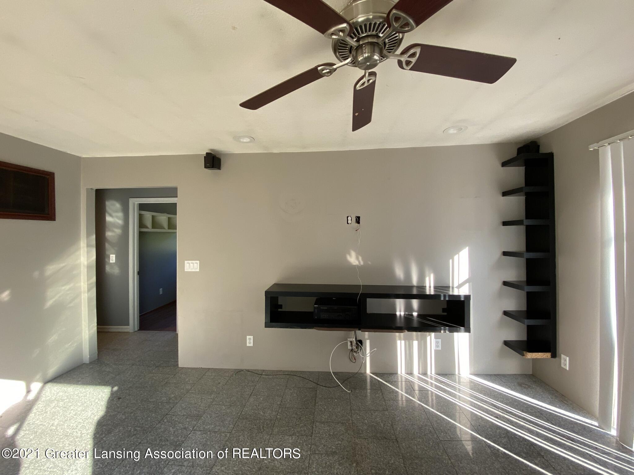 8650 West Jason Road St. Johns, MI 48879 - Photo 6 of 37 06 Living room with granite flooring and