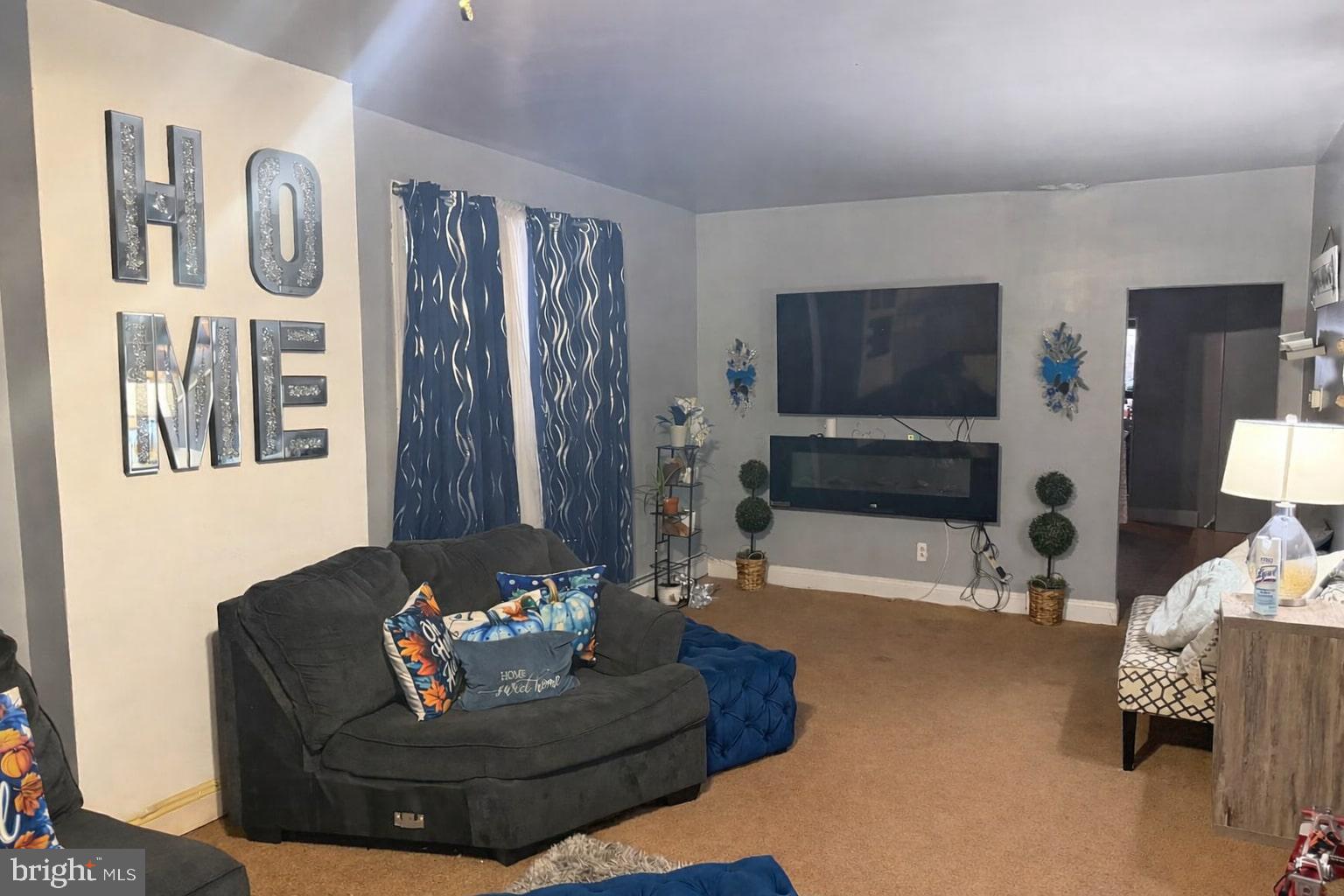 3727 6th Street Brookhaven, PA 19015 - Photo 2 of 9 a living room with furniture and a flat screen tv