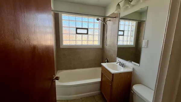 a bathroom with a sink toilet and bathtub