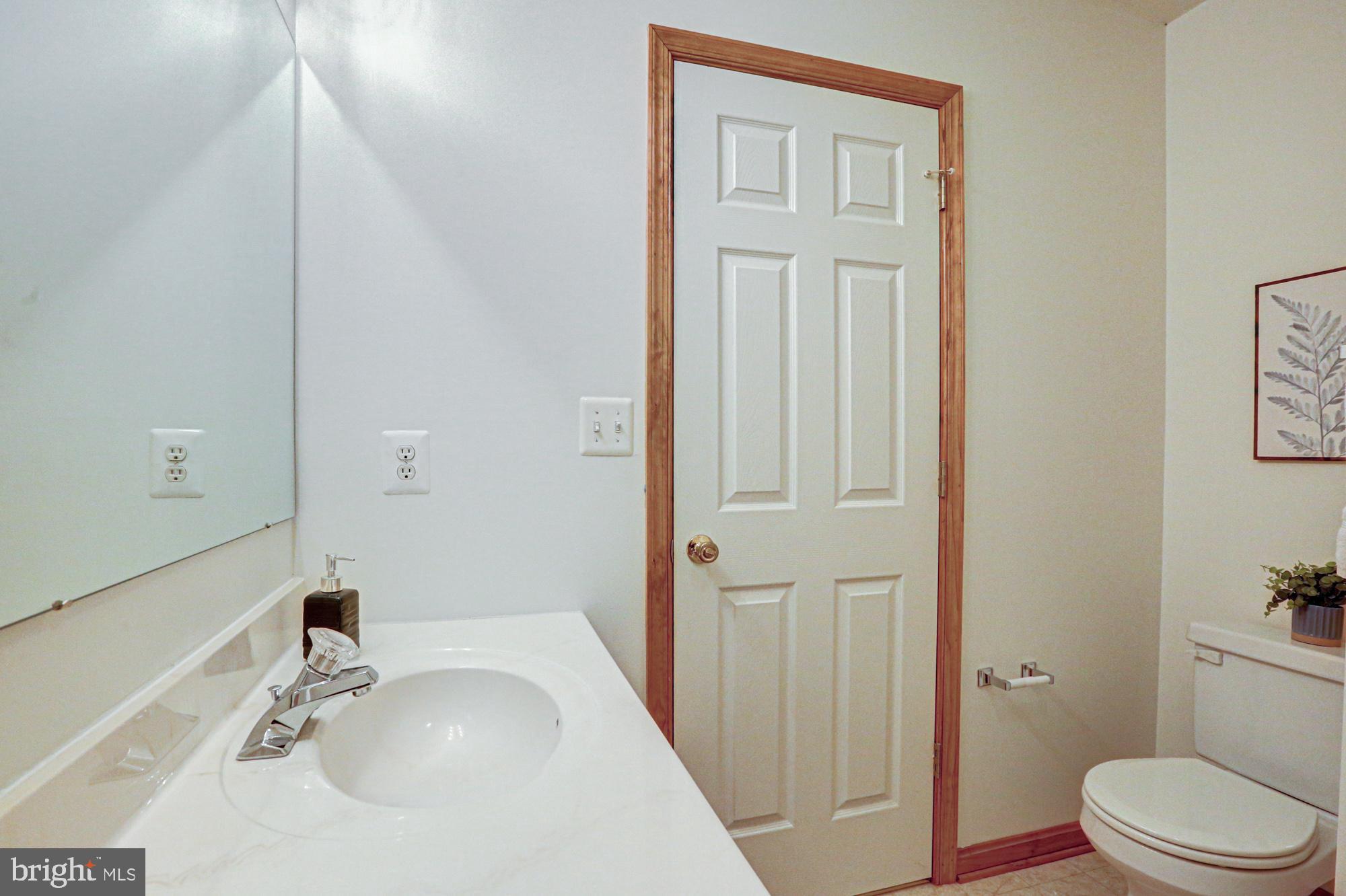 230 Tina Marie Lane Smyrna, DE 19977 - Photo 51 of 83 a bathroom with a sink a toilet and shower