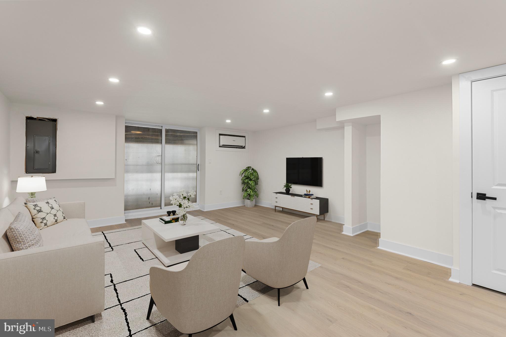 10867 Harrow Road Philadelphia, PA 19154 - Photo 18 of 19 a living room with furniture and a flat screen tv