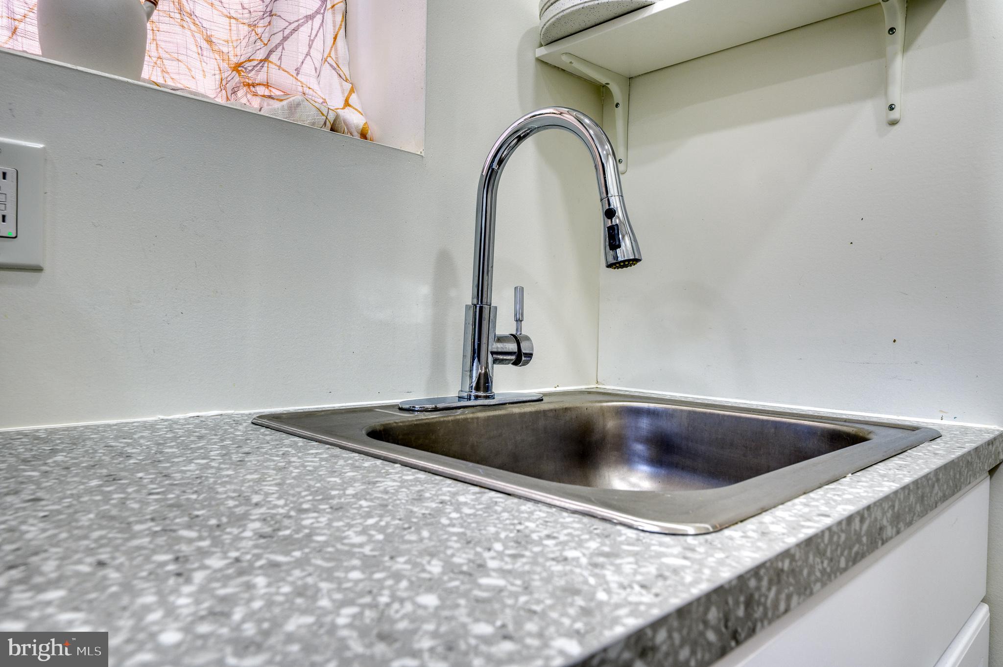 7104 Harford Road Baltimore, MD 21234 - Photo 29 of 37 a close view of sink and tap