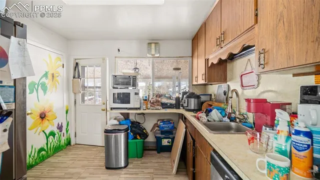 a kitchen with stainless steel appliances granite countertop a stove and a refrigerator