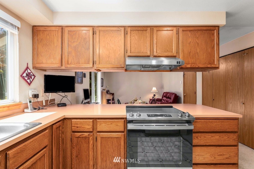22915 13th Place West Bothell, WA 98021 - Photo 12 of 28 a kitchen with a stove and a sink