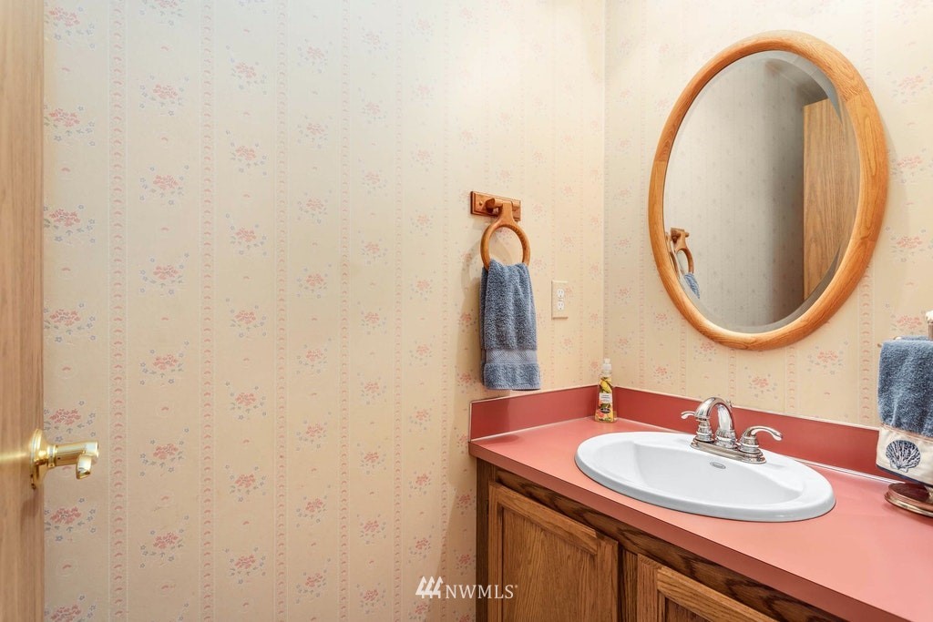 22915 13th Place West Bothell, WA 98021 - Photo 16 of 28 a bathroom with a sink and a mirror