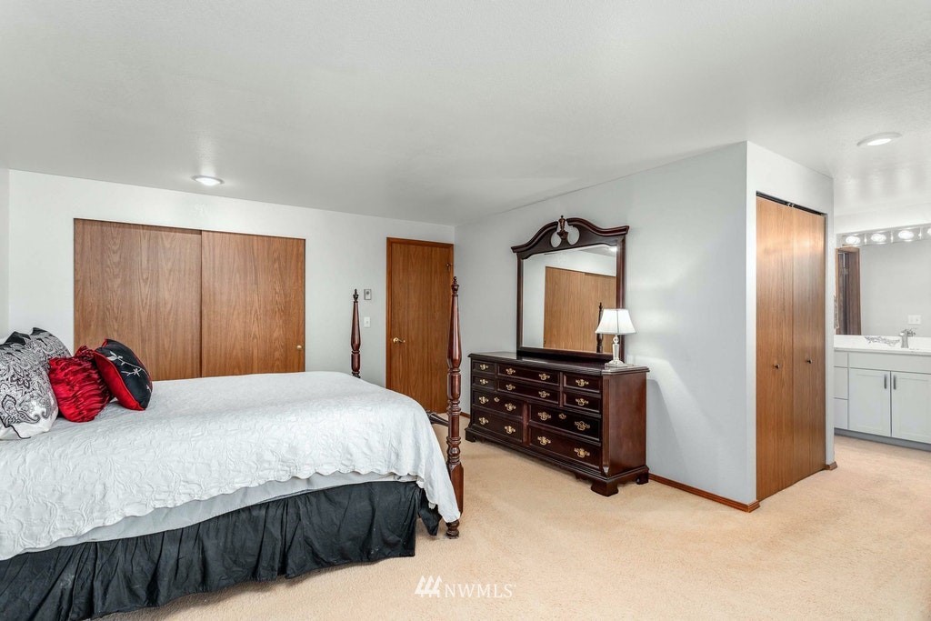 22915 13th Place West Bothell, WA 98021 - Photo 18 of 28 a bedroom with a bed and a closet