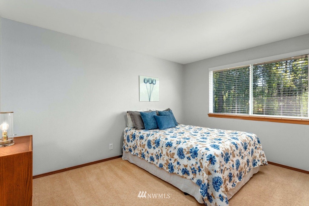 22915 13th Place West Bothell, WA 98021 - Photo 20 of 28 a bedroom with a bed and window
