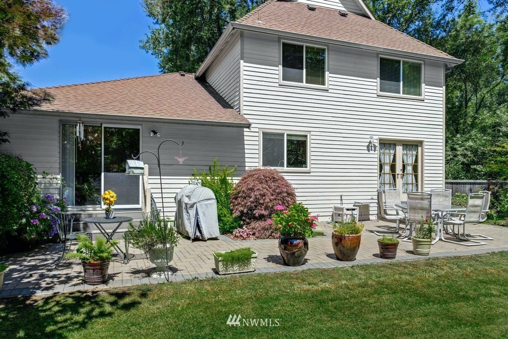 22915 13th Place West Bothell, WA 98021 - Photo 24 of 28 a front view of a house with garden