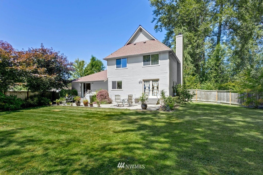 22915 13th Place West Bothell, WA 98021 - Photo 25 of 28 a front view of a house with a garden