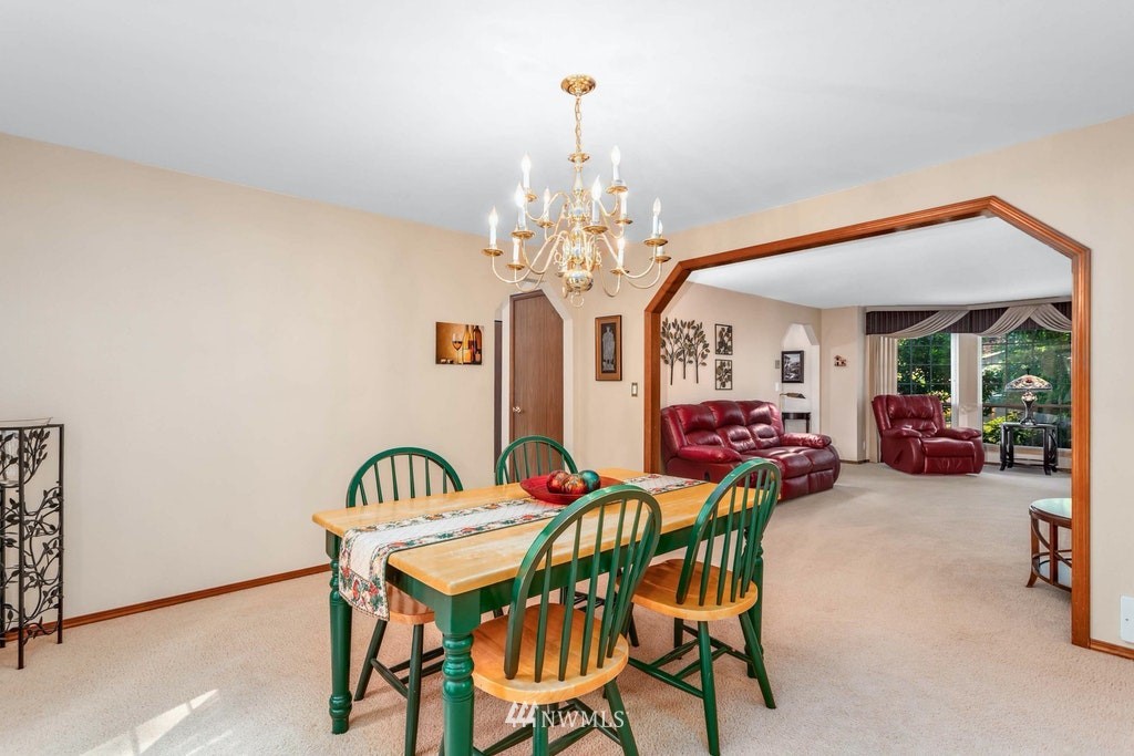 22915 13th Place West Bothell, WA 98021 - Photo 9 of 28 a view of a dining room with furniture and chandelier