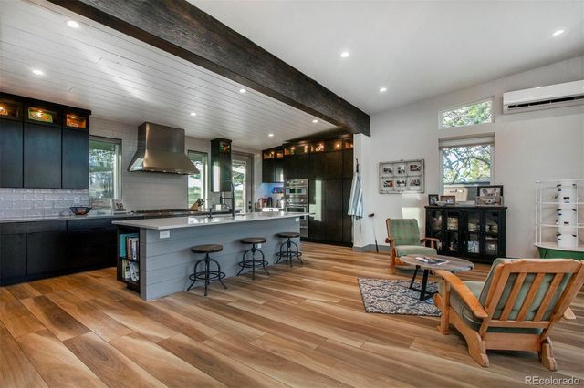 a kitchen with a table and chairs