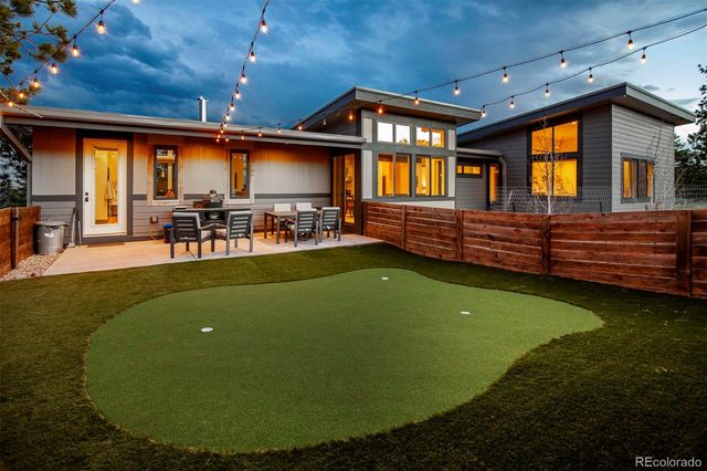an aerial view of a house with a ocean view