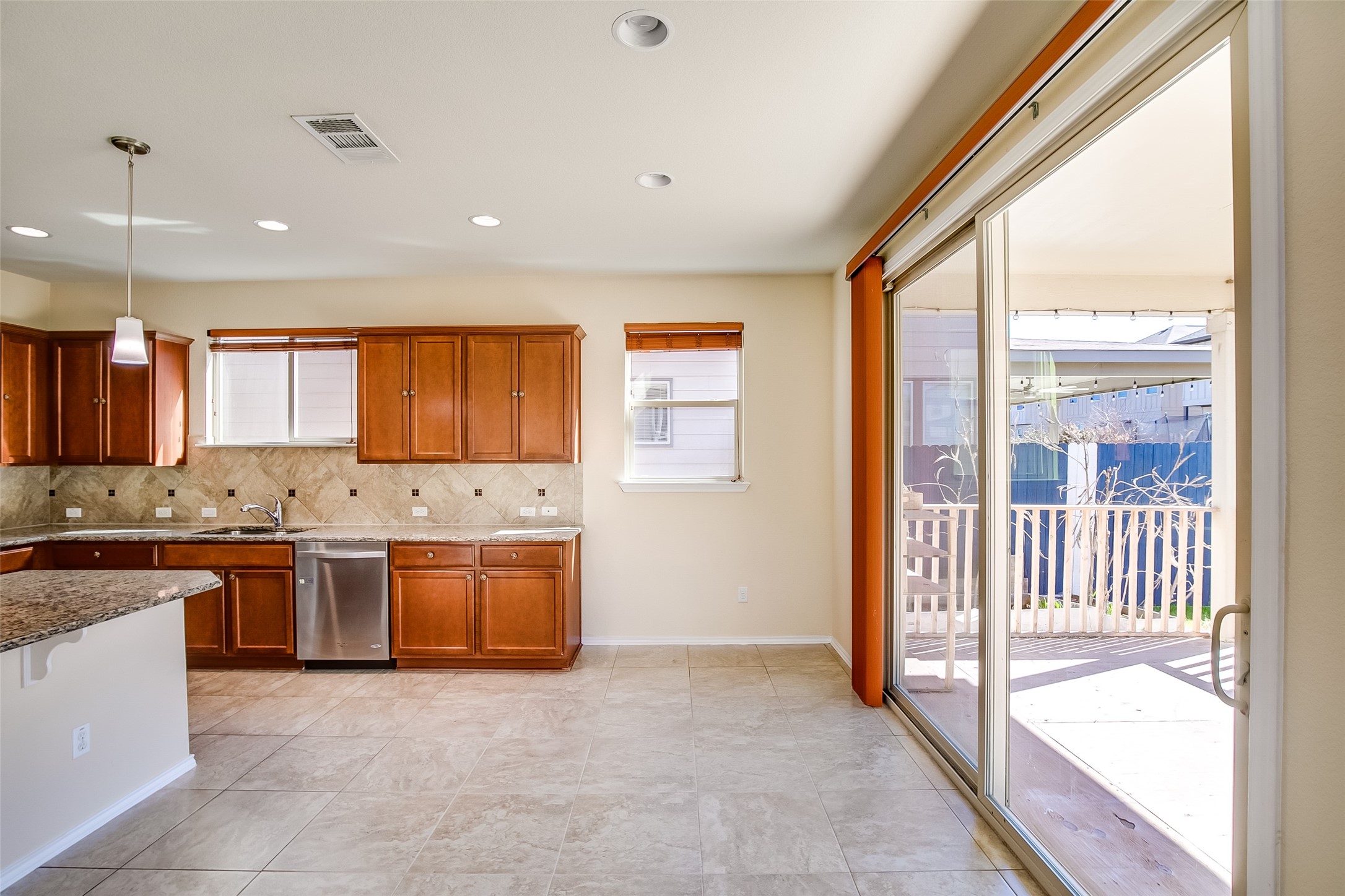 3717 Dover Ferry Crossing Austin, TX 78728 - Photo 12 of 29 a large kitchen with stainless steel appliances granite countertop a stove a sink and a refrigerator