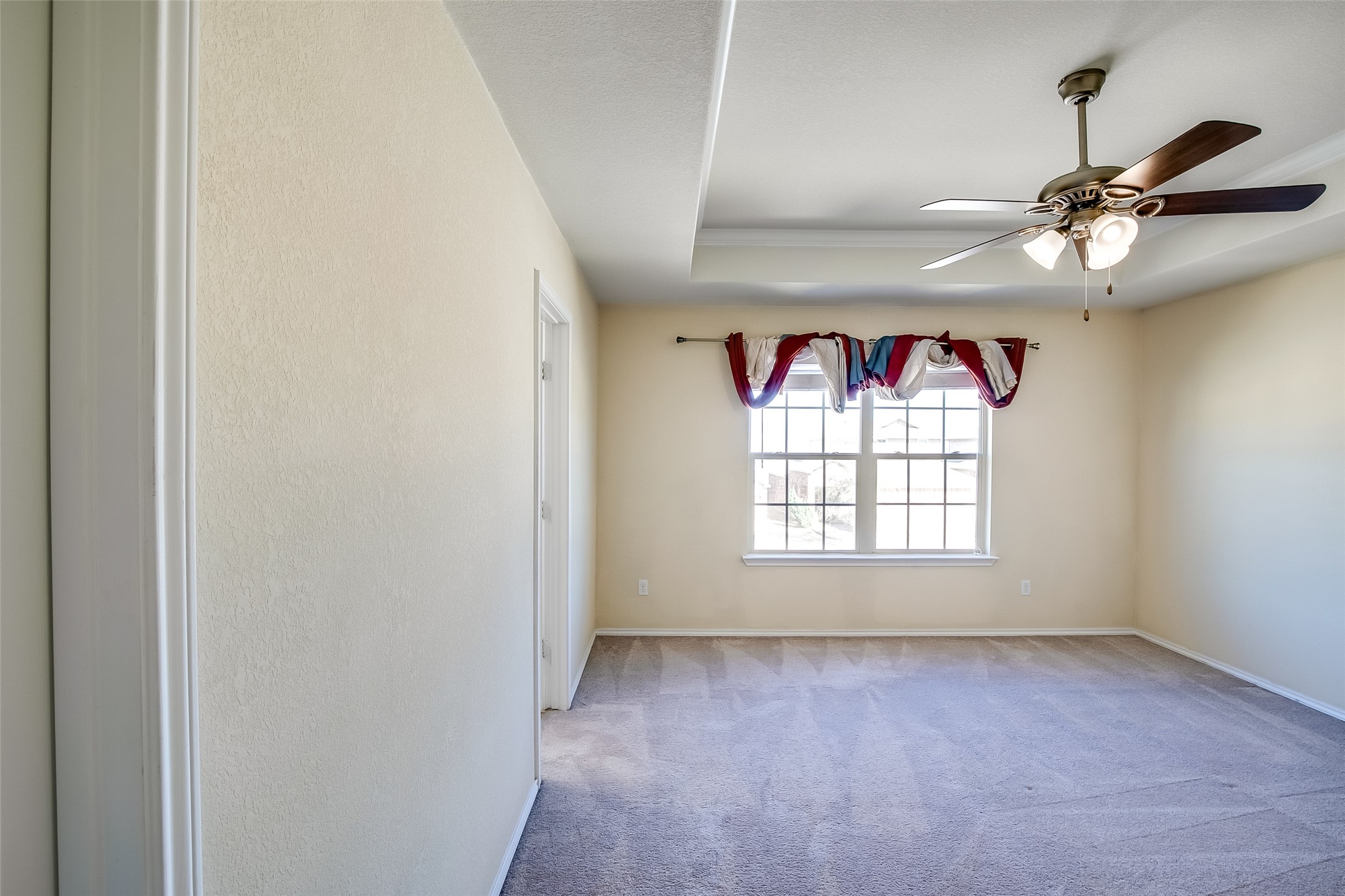 3717 Dover Ferry Crossing Austin, TX 78728 - Photo 15 of 29 an empty room with a window and a ceiling fan