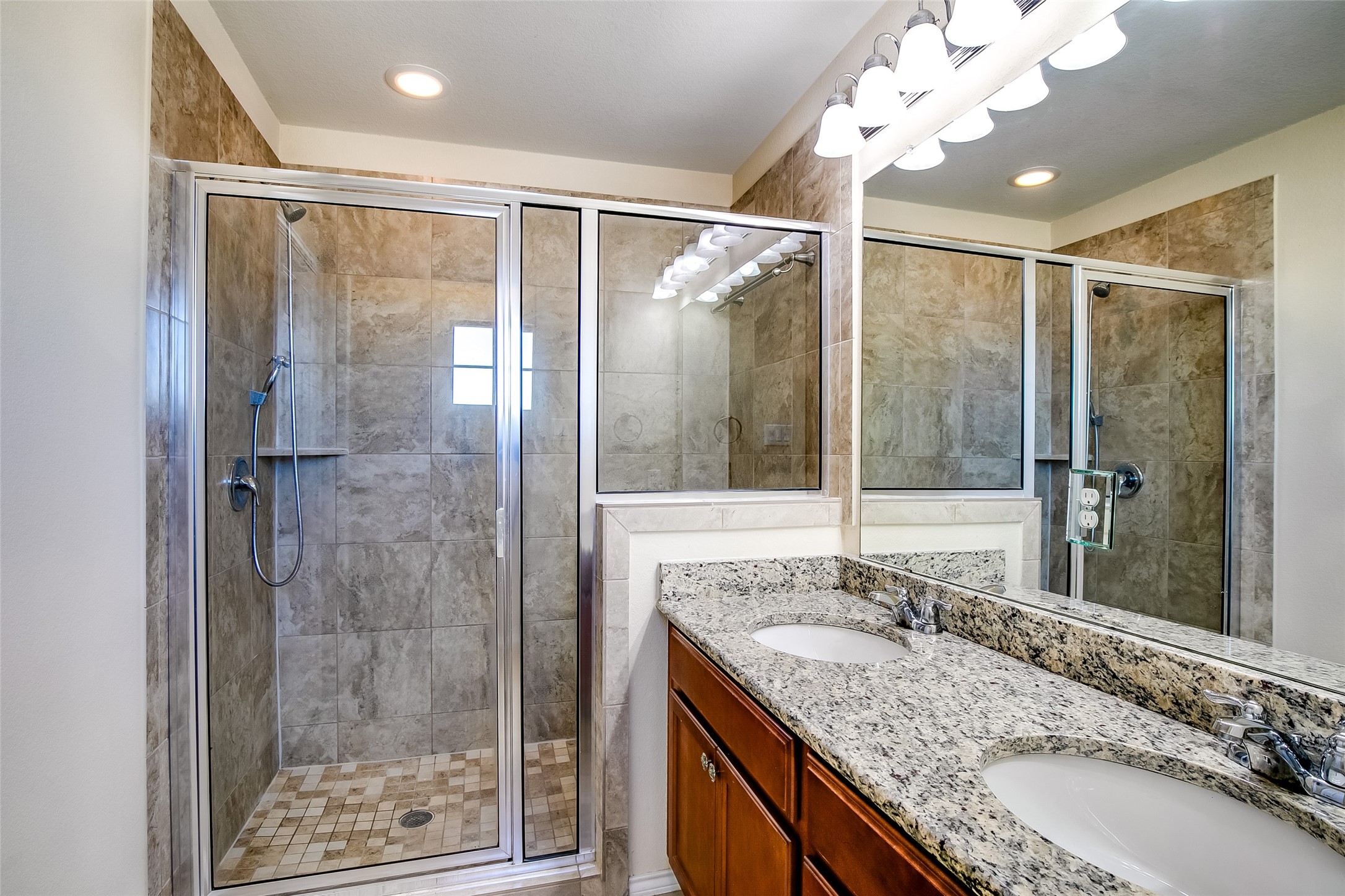 3717 Dover Ferry Crossing Austin, TX 78728 - Photo 20 of 29 a bathroom with a granite countertop sink mirror and shower