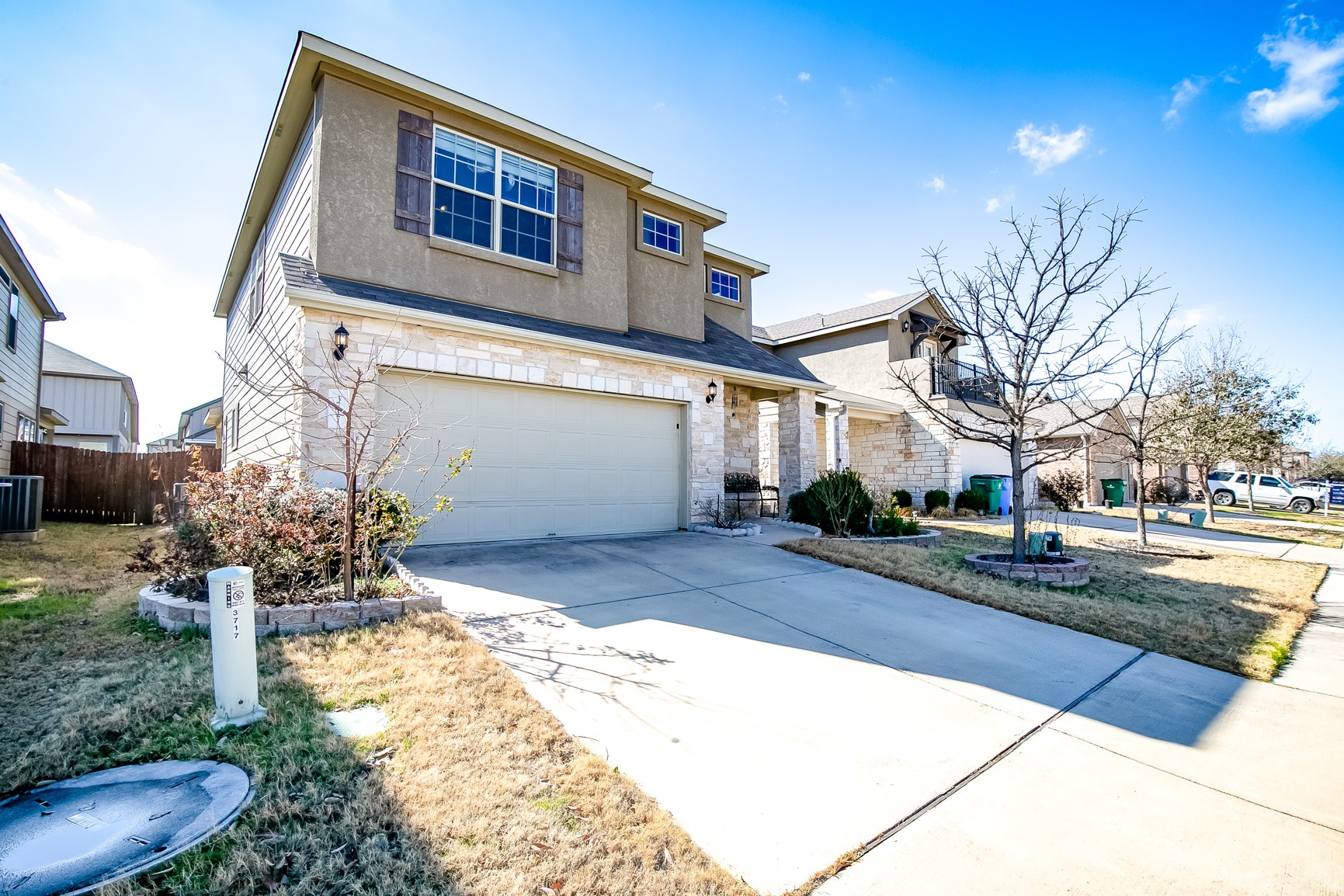 3717 Dover Ferry Crossing Austin, TX 78728 - Photo 2 of 29 a front view of a house with a yard and garage