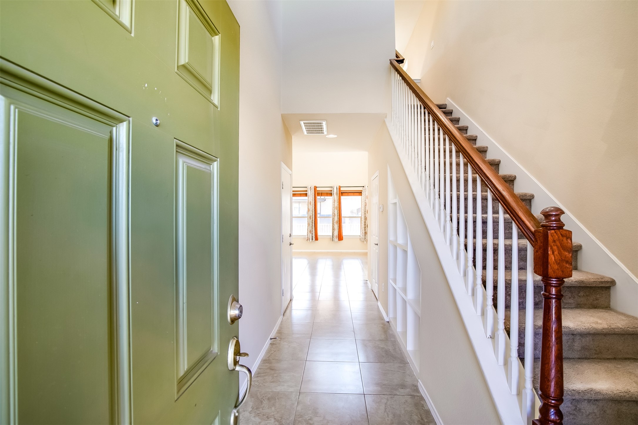 3717 Dover Ferry Crossing Austin, TX 78728 - Photo 4 of 29 a view of a hallway with wooden floor and staircase