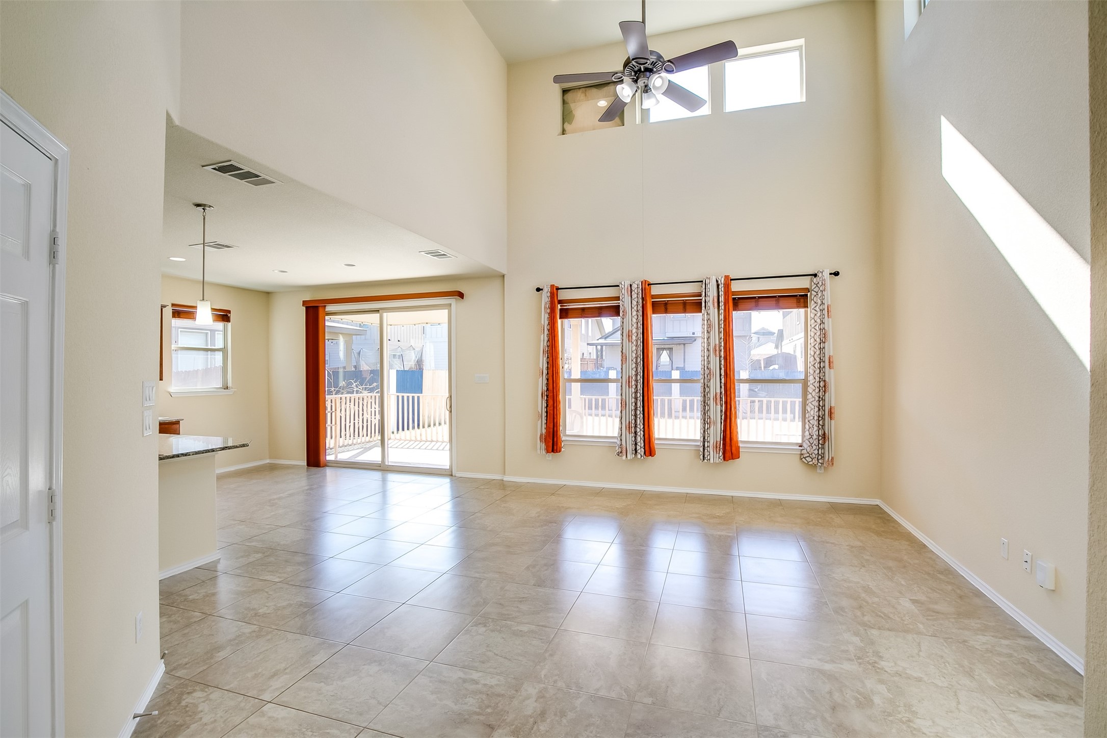 3717 Dover Ferry Crossing Austin, TX 78728 - Photo 5 of 29 a view of an empty room with wooden floor and a window