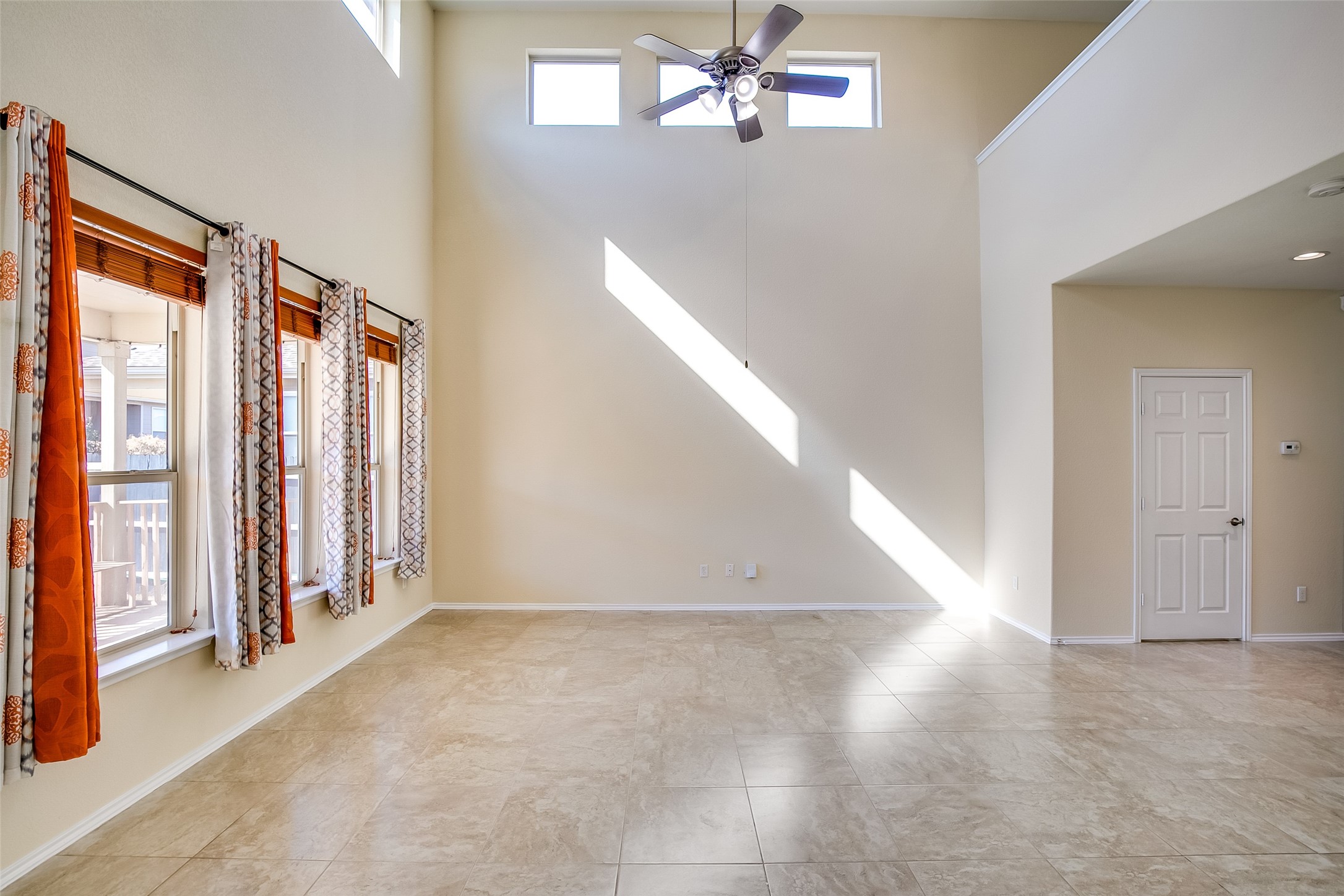 3717 Dover Ferry Crossing Austin, TX 78728 - Photo 6 of 29 wooden floor in an empty room with a window