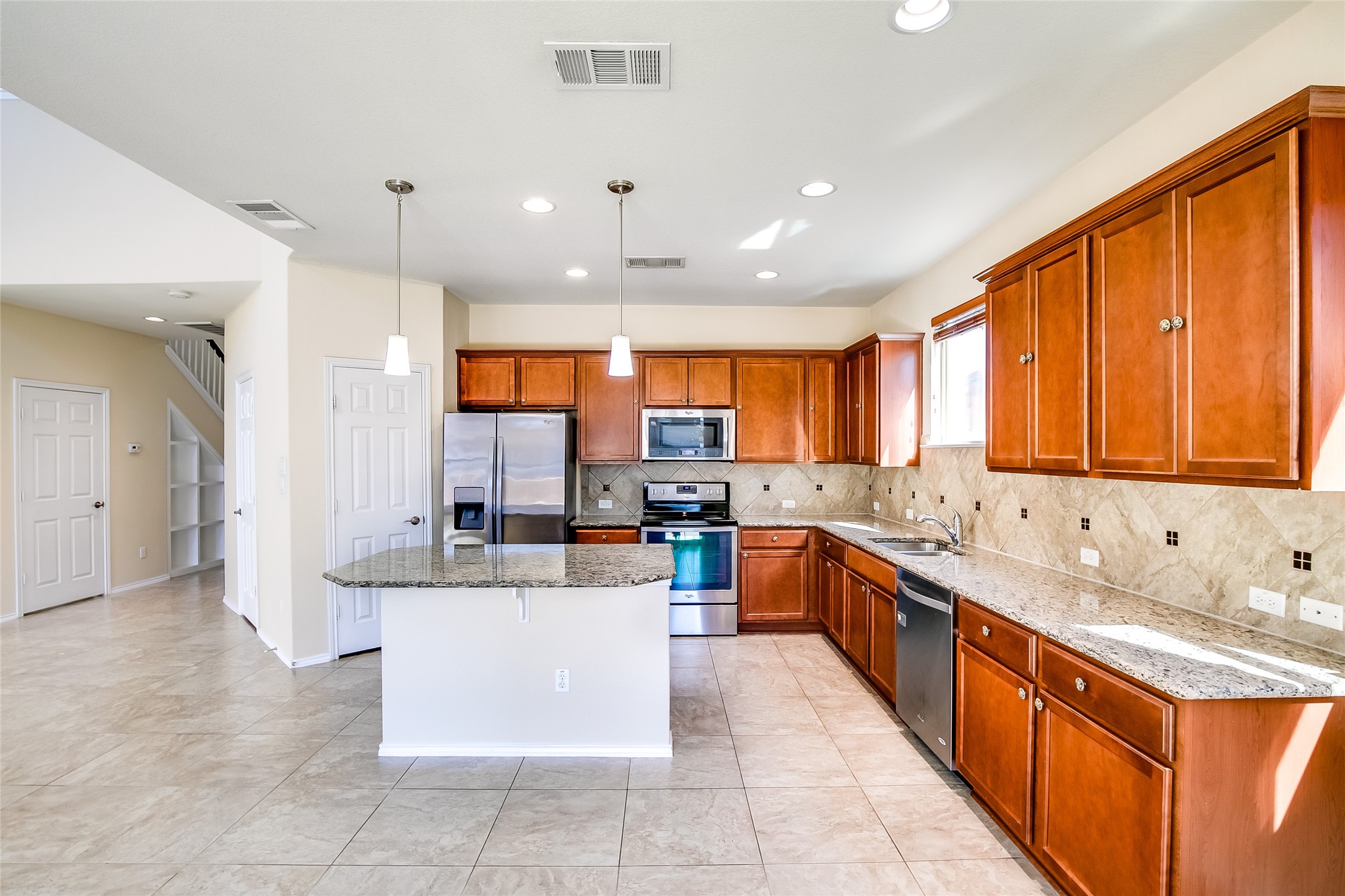 3717 Dover Ferry Crossing Austin, TX 78728 - Photo 10 of 29 a large kitchen with a large counter top cabinets and stainless steel appliances