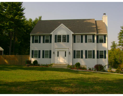 2 April Pepperell, MA 01463 - Photo 1 of 6 a front view of a house with a yard