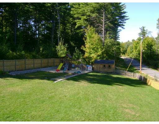 2 April Pepperell, MA 01463 - Photo 2 of 6 a view of a backyard with a garden