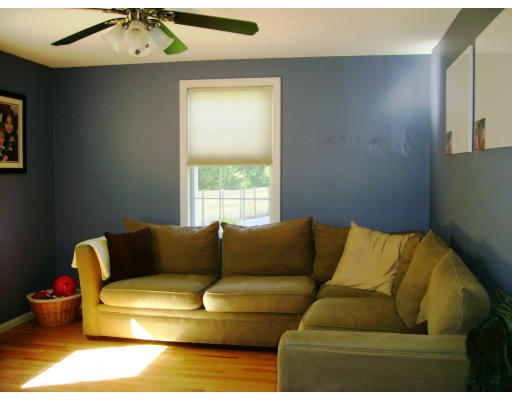2 April Pepperell, MA 01463 - Photo 5 of 6 a living room with furniture and a window